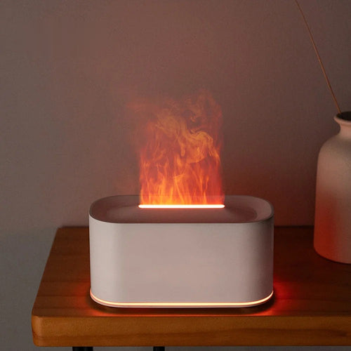 Diffuseur effet flamme blanc allumé sur une table de chevet